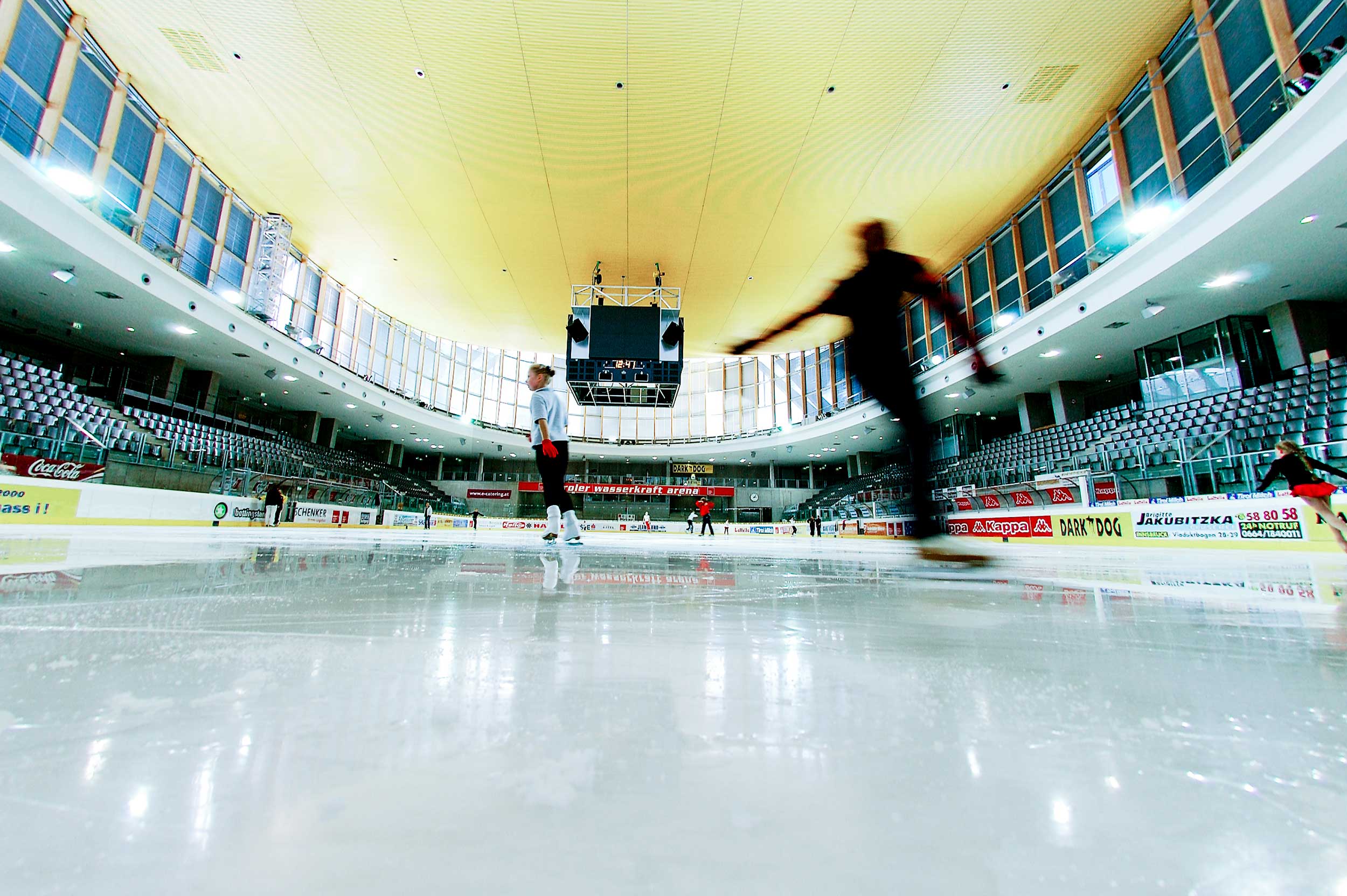 Olympiaworld Innsbruck TIWAG Arena ice rink with ice skaters